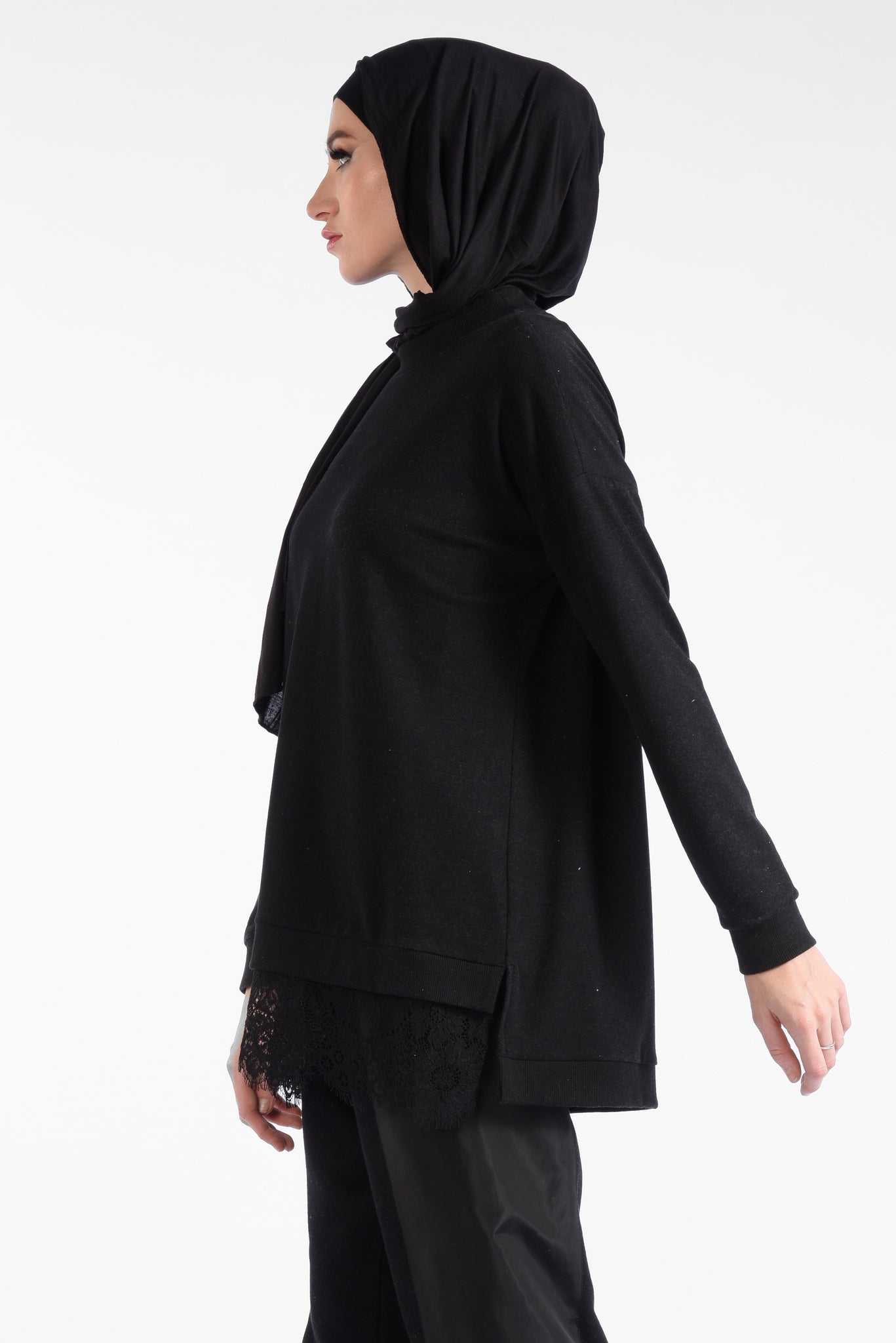 Black blouse with a round neck and a pattern